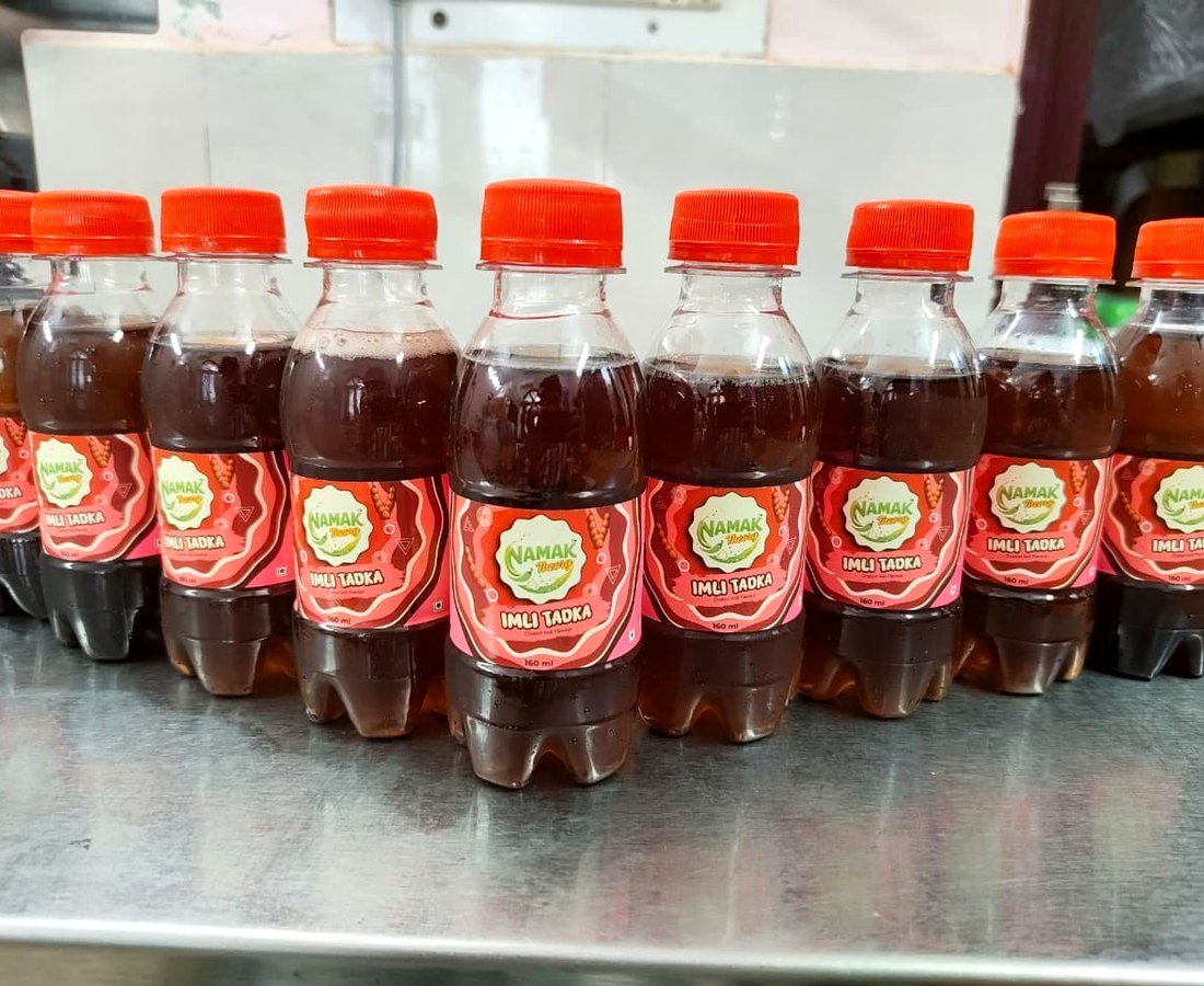 A row of NAMAK Theory Imli Tadka bottles